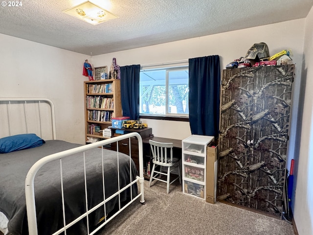 carpeted bedroom featuring a textured ceiling