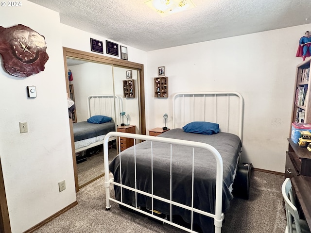 27877 Skinner Ln, Baker City, OR 97814 - bedroom featuring a closet, carpet flooring, baseboards, and a textured ceiling