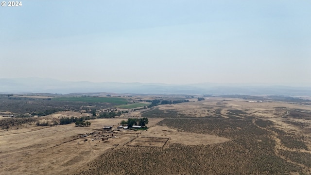 aerial view featuring a mountain view and a rural view