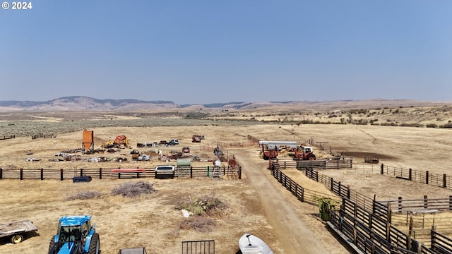 birds eye view of property with a rural view and a mountain view