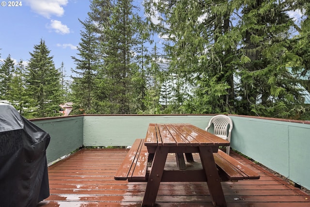 wooden terrace with area for grilling