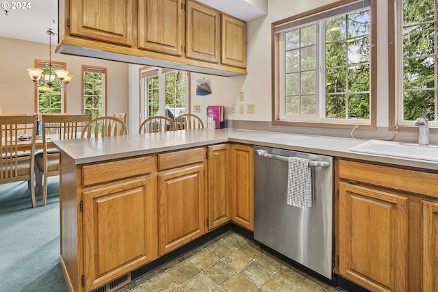 kitchen featuring carpet, a notable chandelier, stainless steel dishwasher, decorative light fixtures, and kitchen peninsula