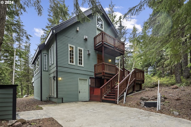 back of property with a balcony