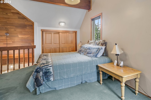 bedroom with a closet, carpet floors, and lofted ceiling with beams