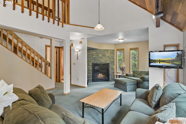 living room with wooden ceiling, high vaulted ceiling, carpet flooring, a fireplace, and beam ceiling