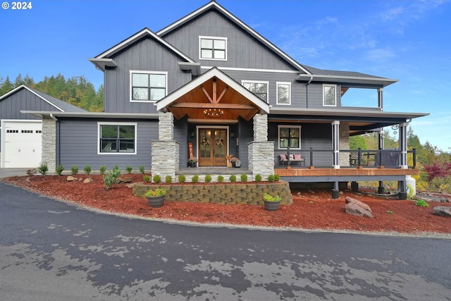 craftsman-style house featuring a garage and covered porch