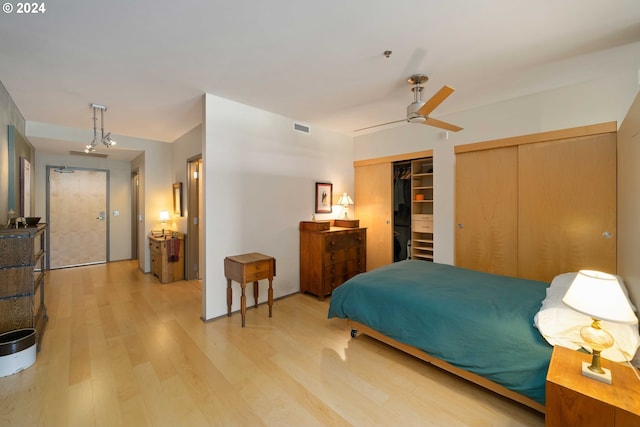 bedroom featuring ceiling fan and light hardwood / wood-style floors