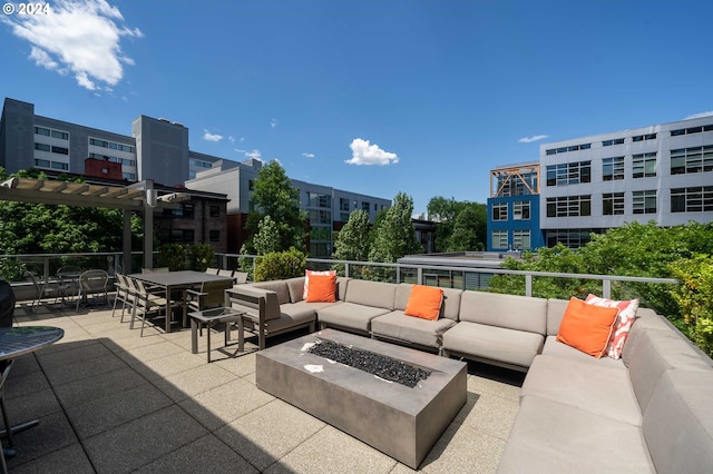 view of patio with a pergola and an outdoor living space with a fire pit