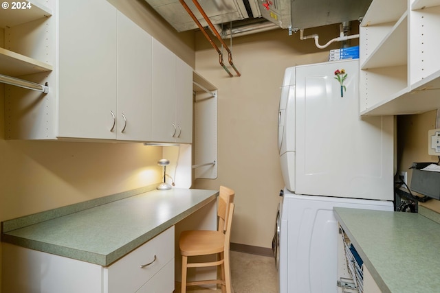 washroom featuring stacked washer and dryer