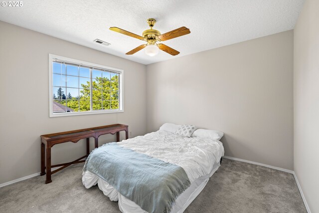 5393 SW Wichita St, Tualatin, OR 97062 - bedroom featuring light carpet, baseboards, ceiling fan, and a textured ceiling