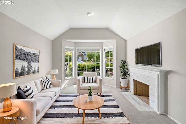 5393 SW Wichita St, Tualatin, OR 97062 - living room featuring carpet floors, baseboards, a fireplace, and lofted ceiling