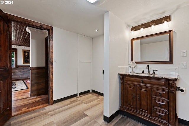 bathroom with vanity and hardwood / wood-style flooring