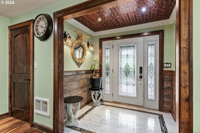 entrance foyer featuring ornamental molding