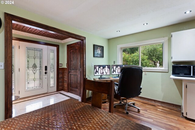 office with light hardwood / wood-style floors