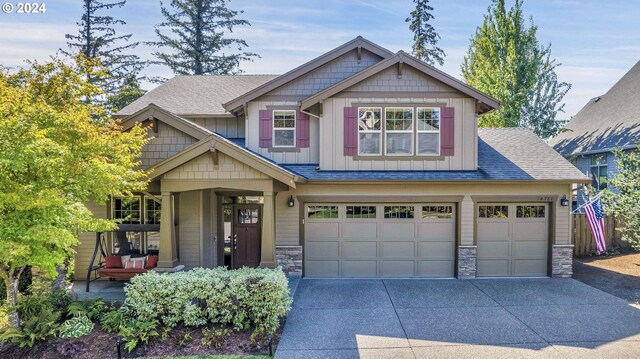 craftsman house with a garage