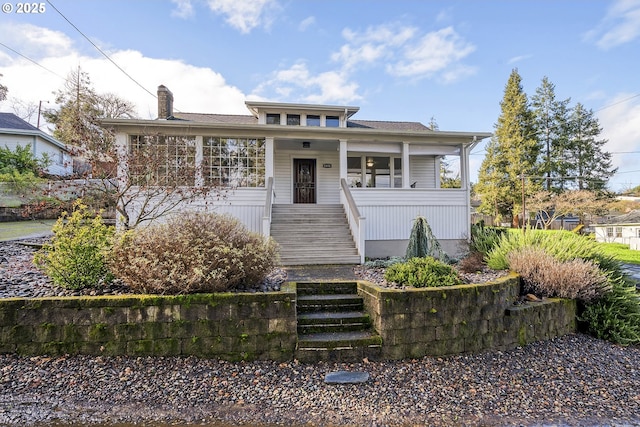 view of front facade featuring a porch and stairs