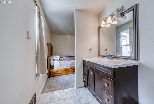 bathroom featuring marble finish floor, visible vents, vanity, and baseboards