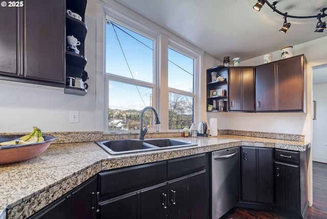 kitchen with dark wood-type flooring, tile counters, open shelves, and a sink