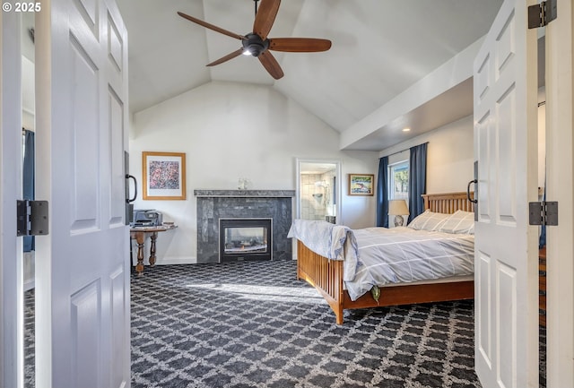 carpeted bedroom featuring lofted ceiling, a tiled fireplace, a ceiling fan, and baseboards