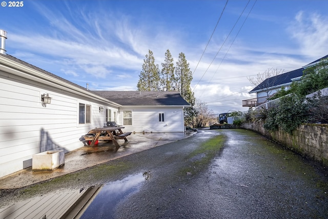 exterior space with crawl space and fence