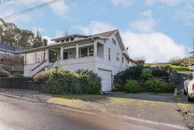 view of front of house with a porch and an attached garage