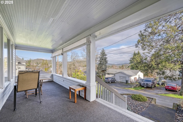 sunroom featuring wood ceiling