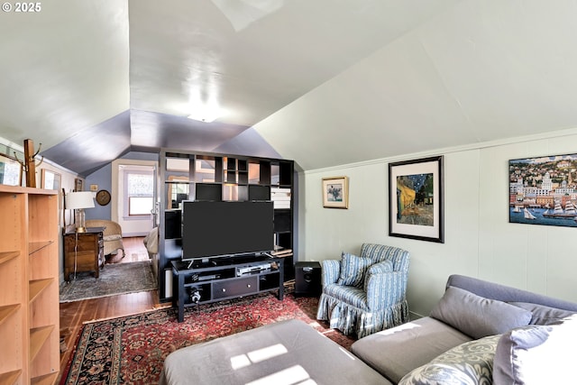 living room featuring lofted ceiling and hardwood / wood-style floors