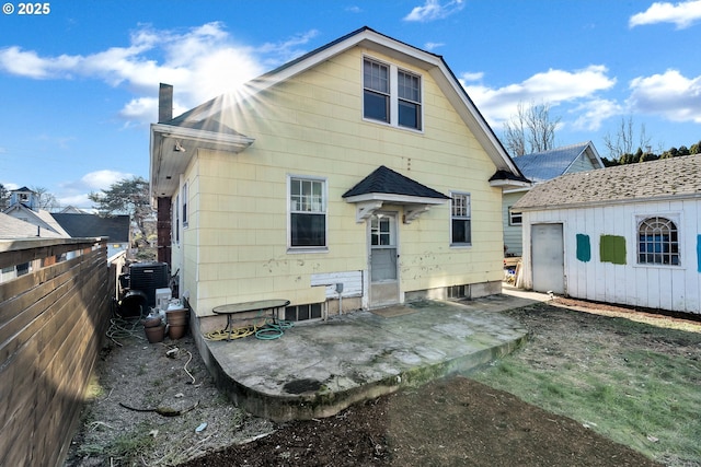 rear view of house with cooling unit