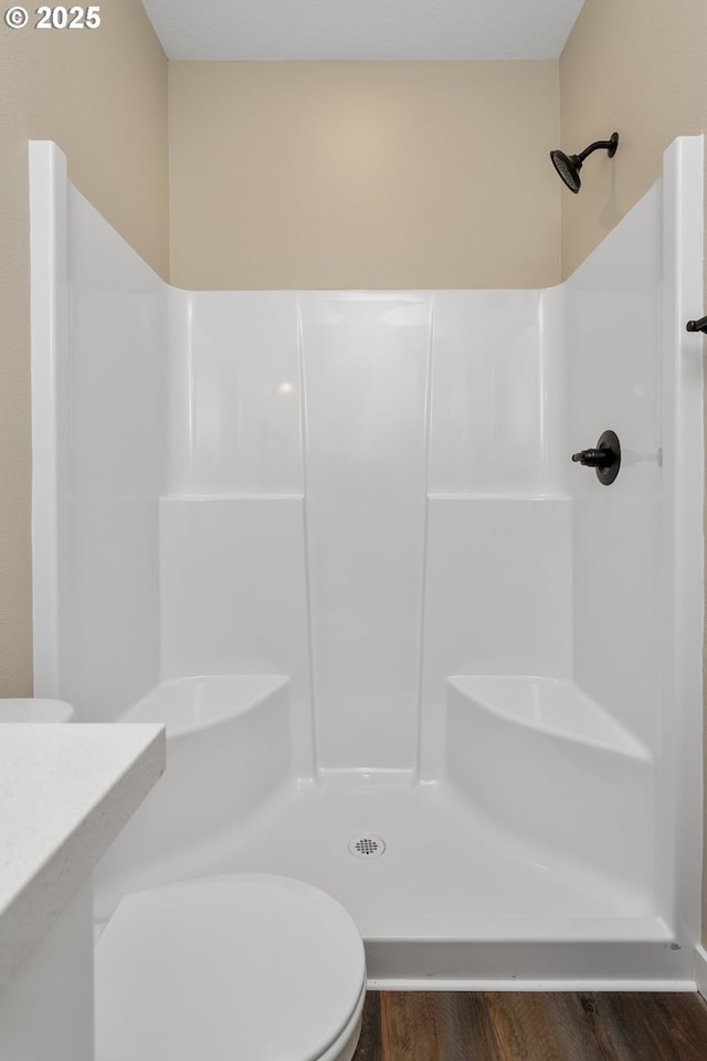 144 E H St, Vernonia, OR 97064 - full bath featuring toilet, wood finished floors, and a shower