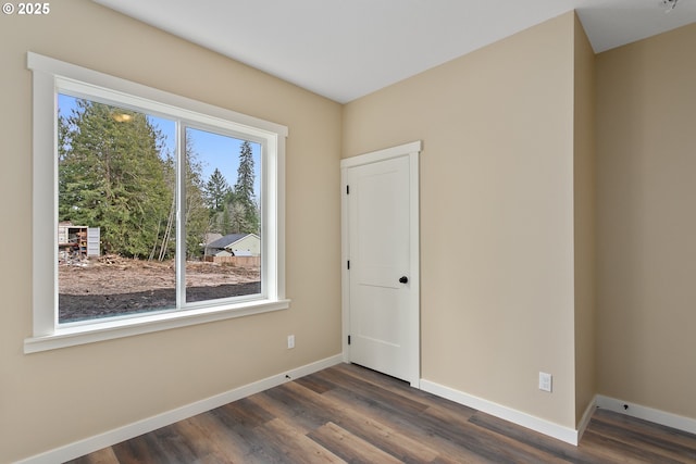 144 E H St, Vernonia, OR 97064 - unfurnished room with baseboards and dark wood-style floors