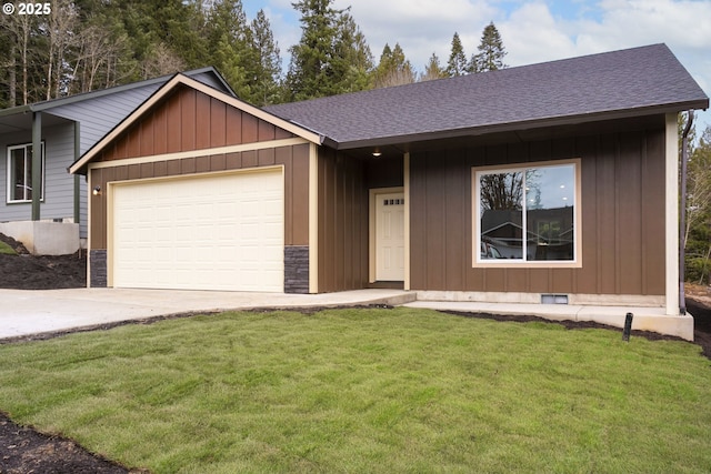 144 E H St, Vernonia, OR 97064 - view of front facade with concrete driveway, a front lawn, a garage, and board and batten siding