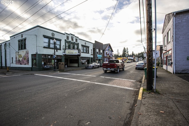 144 E H St, Vernonia, OR 97064 - view of asphalt road featuring sidewalks, curbs, and street lighting