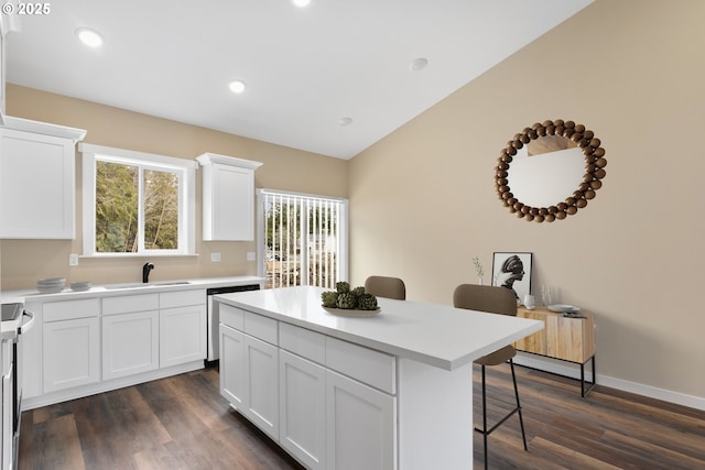 144 E H St, Vernonia, OR 97064 - kitchen featuring a kitchen bar, dishwasher, a kitchen island, plenty of natural light, and vaulted ceiling