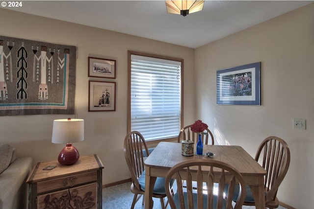 dining area featuring carpet floors