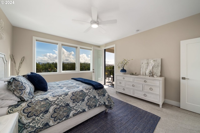 carpeted bedroom featuring access to outside and ceiling fan