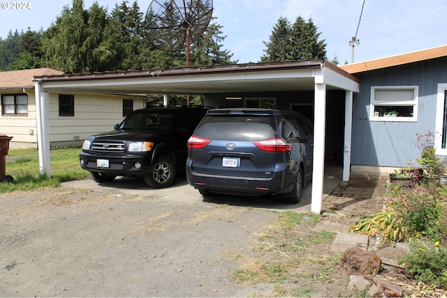 view of parking / parking lot with a carport