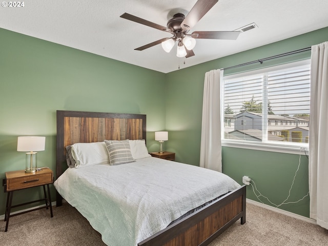 bedroom featuring ceiling fan and light colored carpet