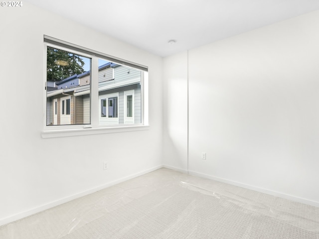 empty room with carpet flooring