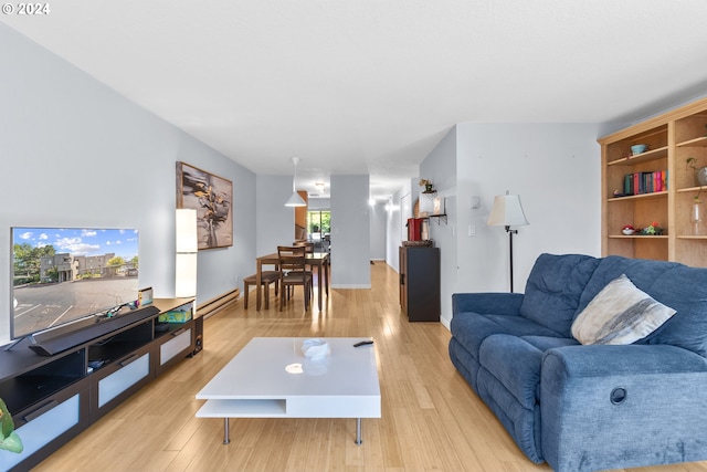 living room featuring light hardwood / wood-style floors and a baseboard radiator