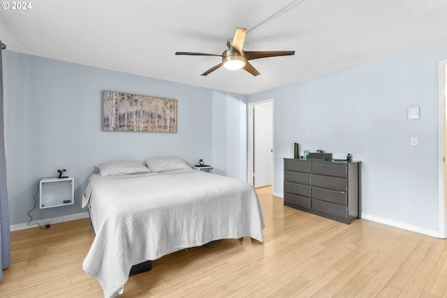 bedroom featuring wood-type flooring and ceiling fan