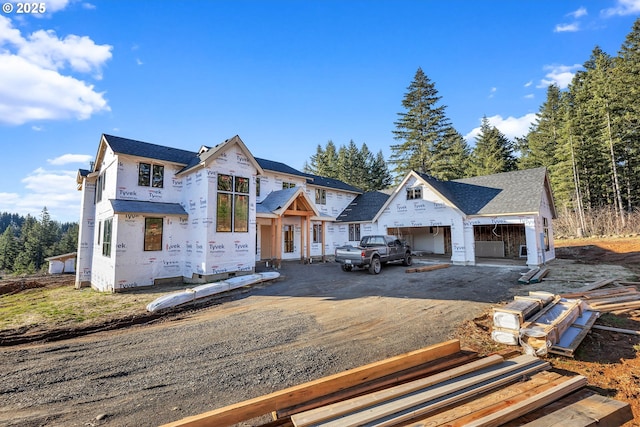 unfinished property with a garage