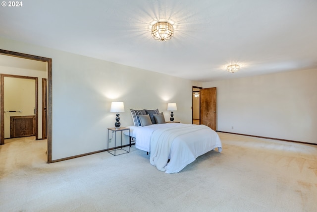 bedroom featuring light colored carpet