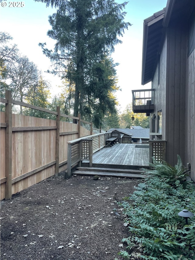 view of yard featuring a wooden deck