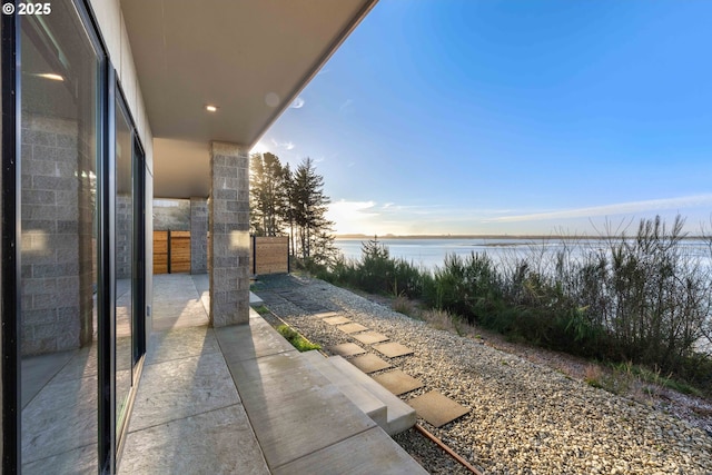 view of patio featuring a water view