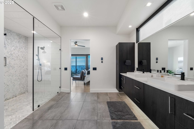 ensuite bathroom featuring visible vents, ensuite bath, double vanity, a sink, and a walk in shower