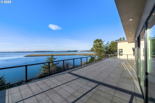 balcony featuring a water view