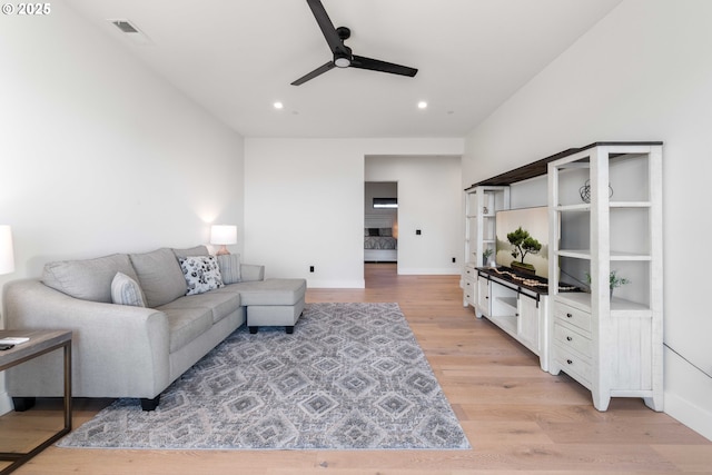 living area featuring baseboards, visible vents, light wood finished floors, recessed lighting, and ceiling fan