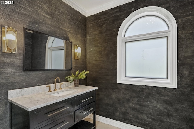 bathroom featuring ornamental molding and vanity