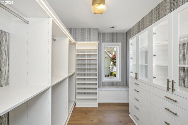 spacious closet featuring hardwood / wood-style floors