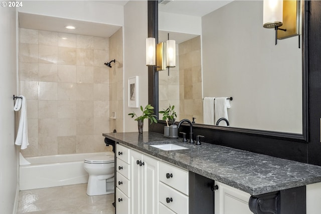 full bathroom with vanity, toilet, and tiled shower / bath